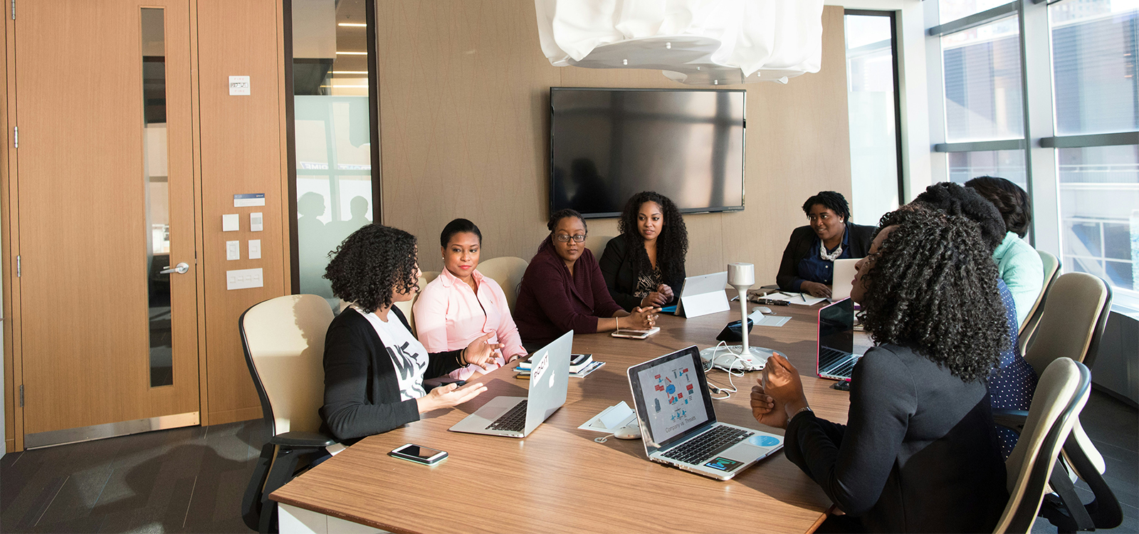 Colleagues sharing ideas around a meeting table.